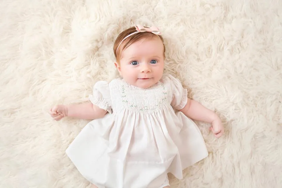 White Smocked Baby Dress with Embroidered Rosettes